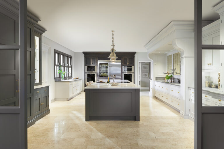 Spacious kitchen with a Down Pipe central island, Cornforth White cabinetry, Chocolate Oak units and a Caesarstone worktop