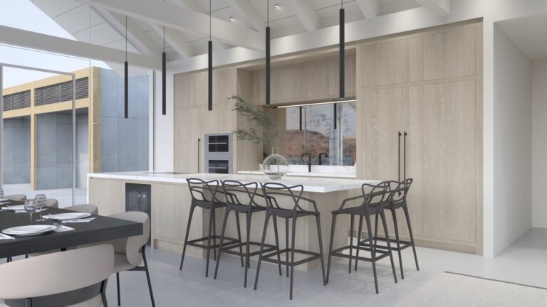 Light oak kitchen with a large island, white worktop, dark bar stools and pendant lighting beneath a vaulted ceiling