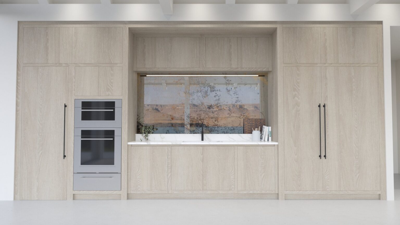 Light oak kitchen cabinetry with built-in ovens, a window above the sink and a sea view beyond