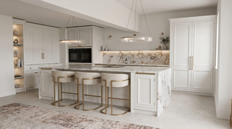 Kitchen with white cabinetry, a large stone-topped island, upholstered bar stools and brass fittings throughout