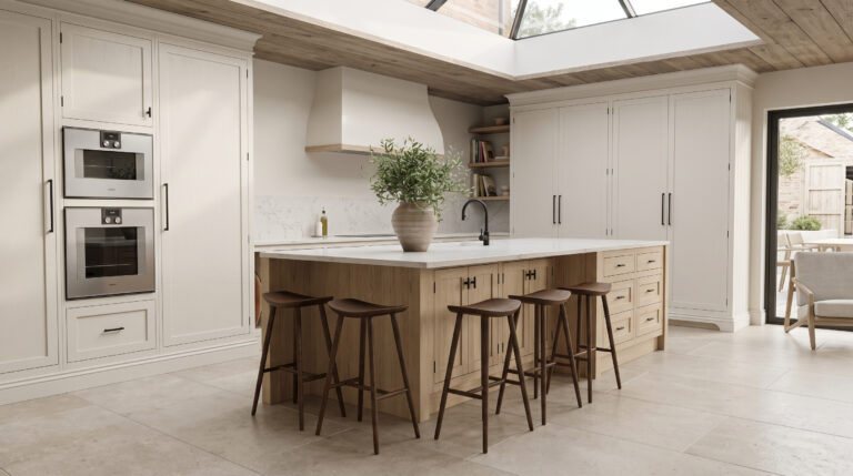 Kitchen with large island, white worktop, five bar stools, built-in ovens and a skylight above