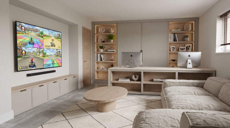 Living room with fitted shelving, a built-in desk with two workstations, wall-mounted television and a round coffee table