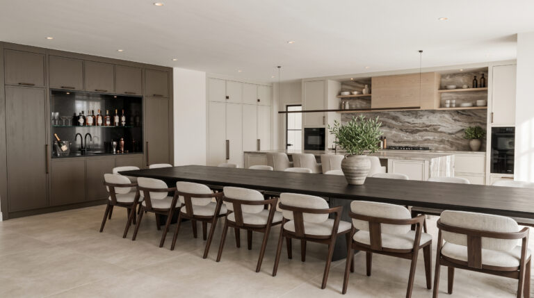 Open-plan kitchen with long dark dining table, upholstered chairs, built-in bar unit and veined stone splashback behind the island